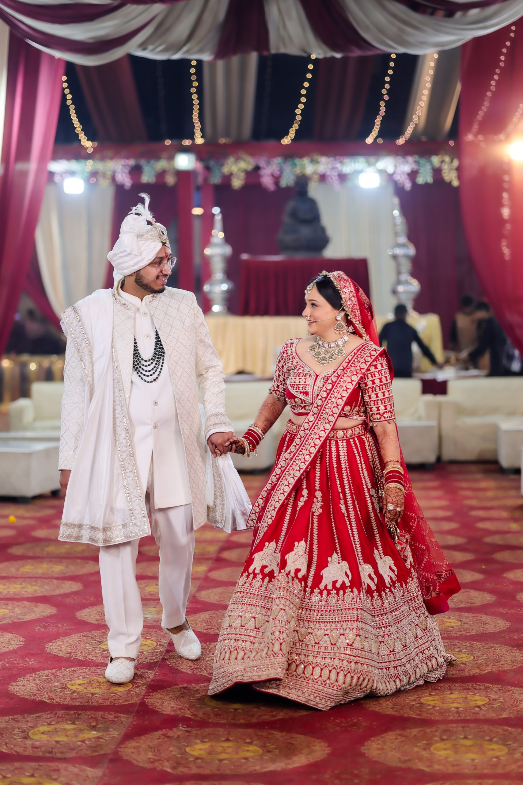 Bride and groom participating in a traditional Indian wedding ceremony